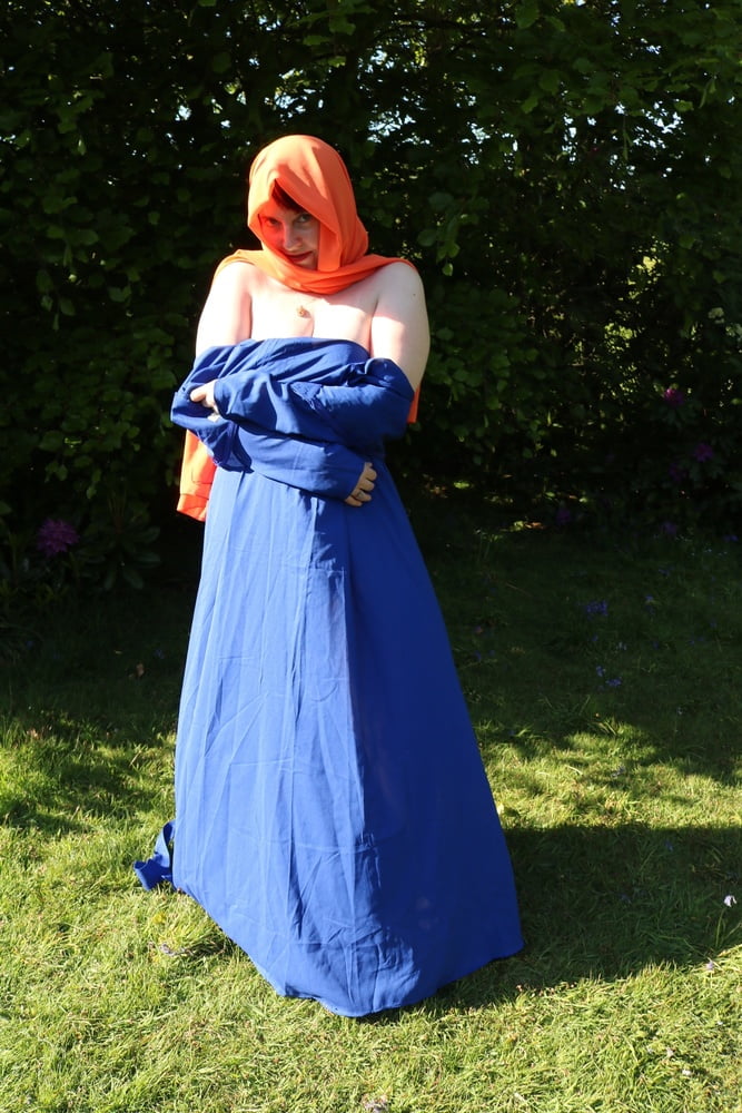 hijab and abaya flashing outdoors #106961738
