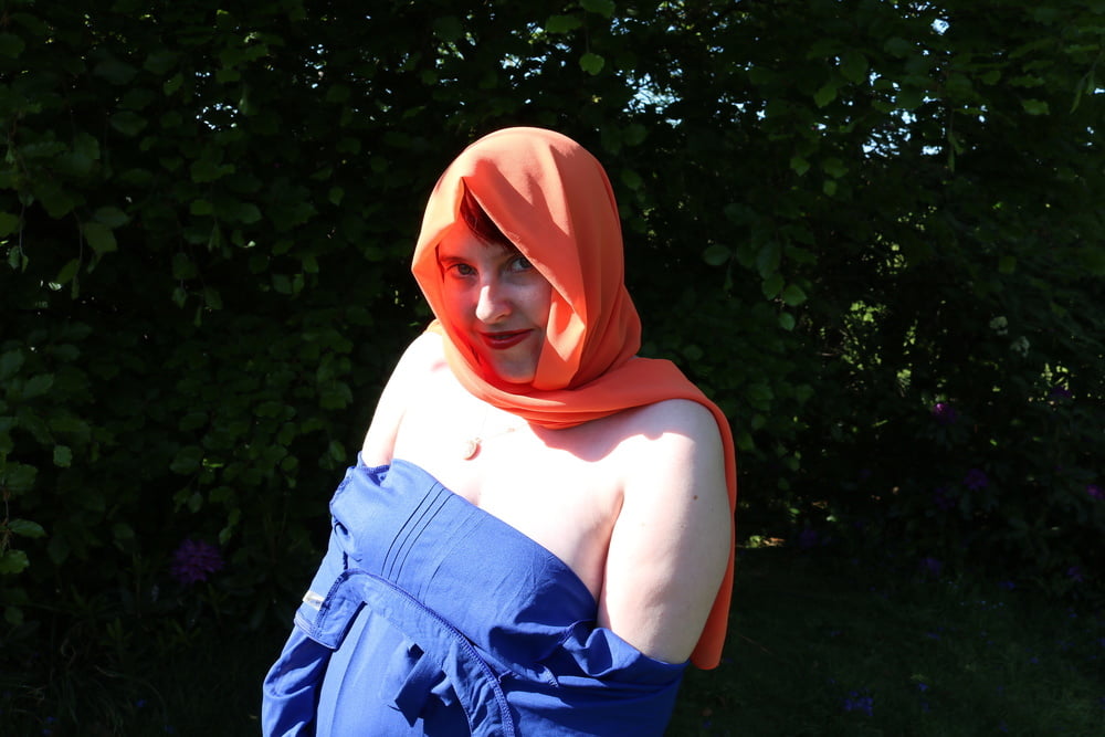 hijab and abaya flashing outdoors #106961740