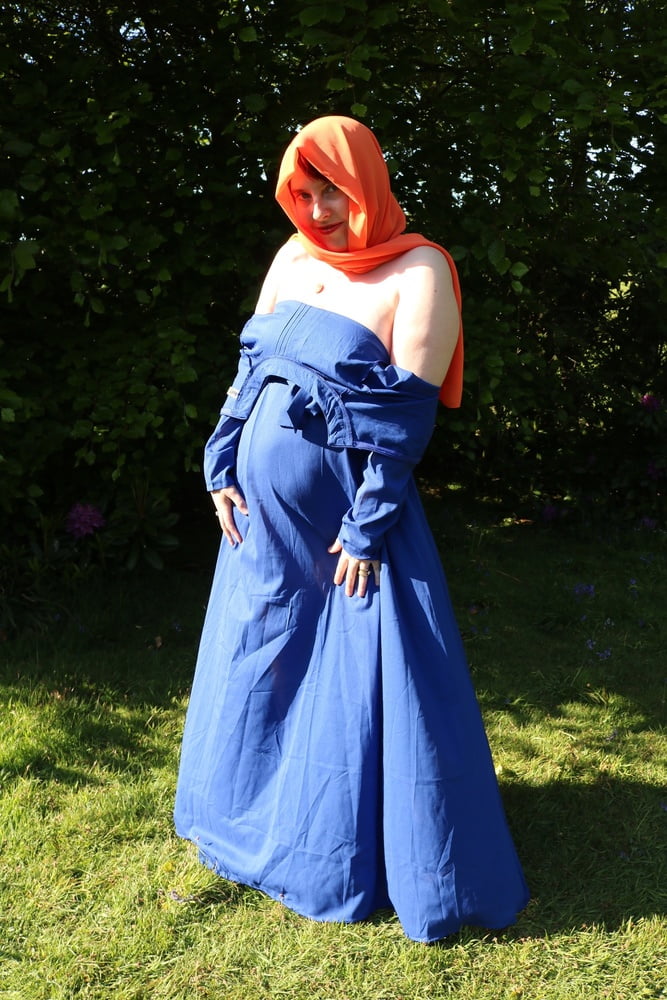 hijab and abaya flashing outdoors #106961741