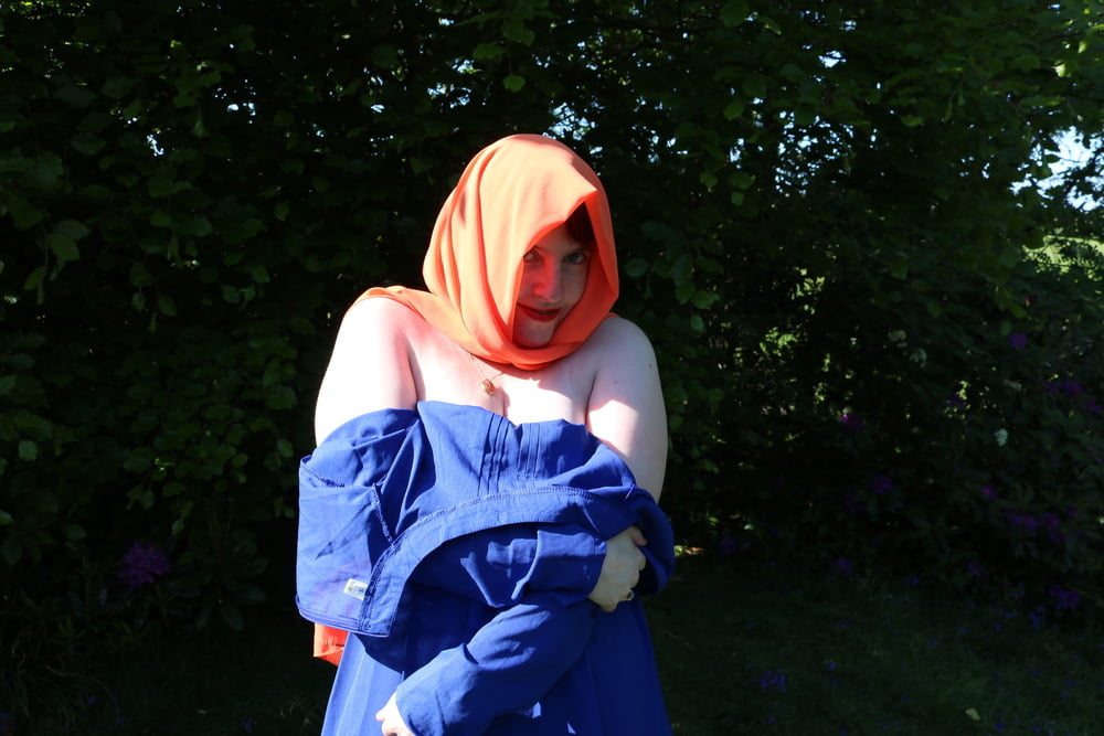 hijab and abaya flashing outdoors #106961747