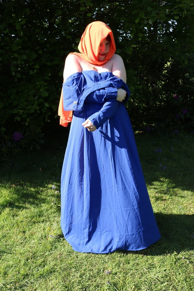 hijab and abaya flashing outdoors #106961748