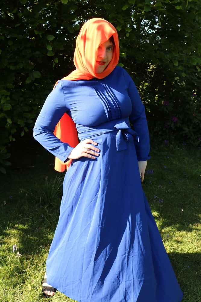 hijab and abaya flashing outdoors #106961768