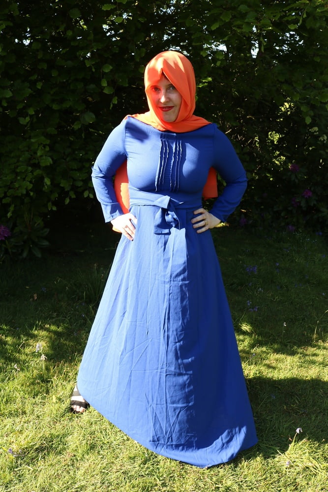 hijab and abaya flashing outdoors #106961769