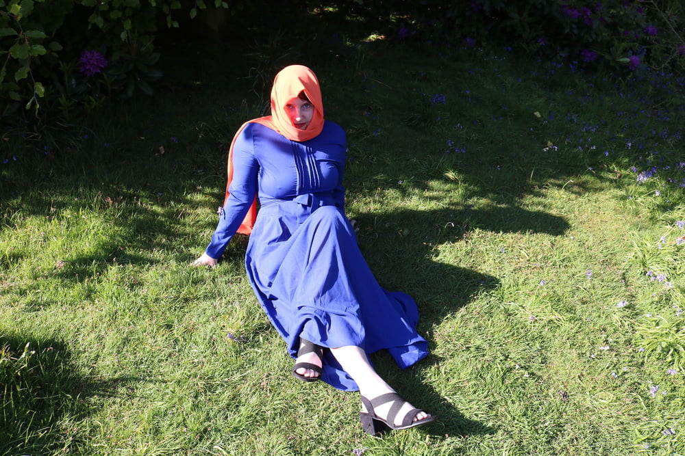 hijab and abaya flashing outdoors #106961777