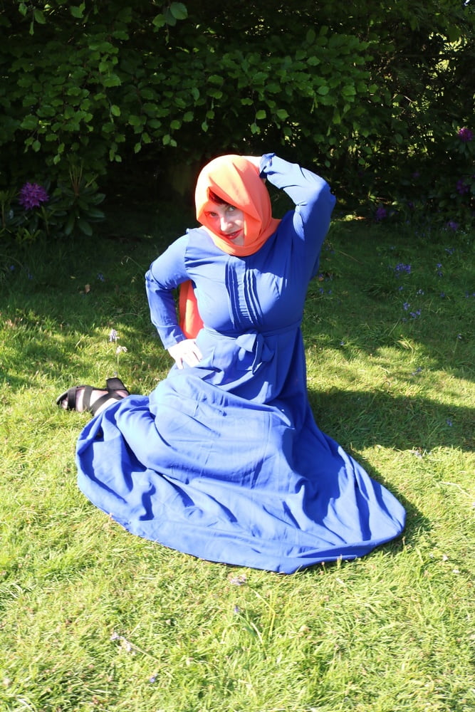 hijab and abaya flashing outdoors #106961780