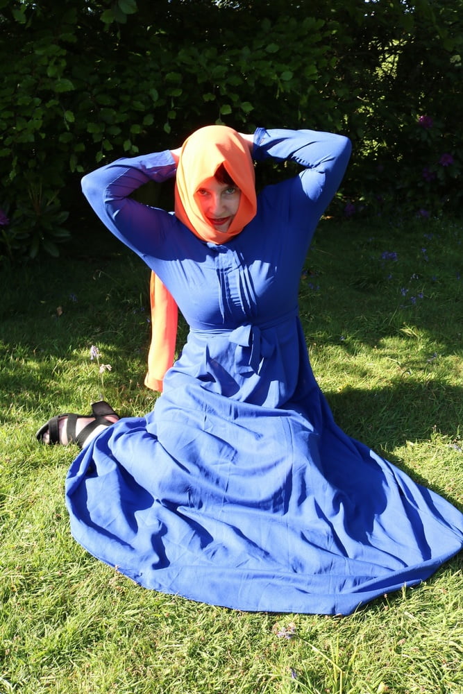 hijab and abaya flashing outdoors #106961781