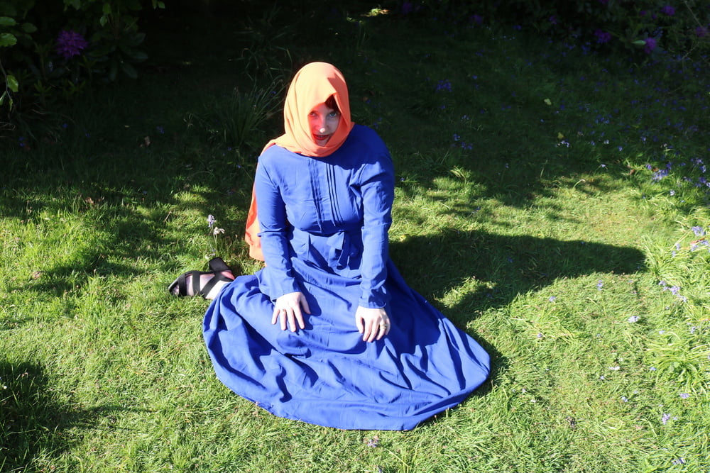 hijab and abaya flashing outdoors #106961783