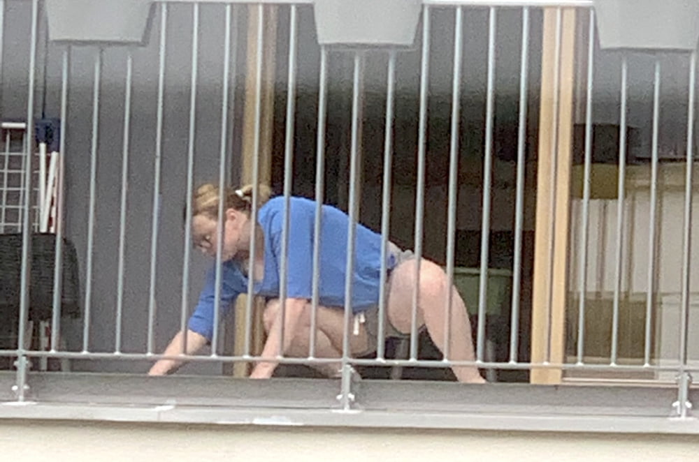 Chubby Neighbour on balcony #94532896