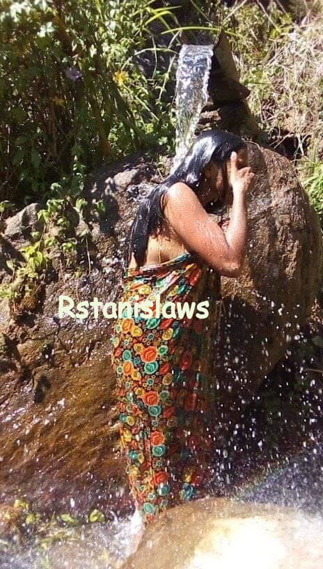 Sri lankan girls bathing outdoor
 #80867291