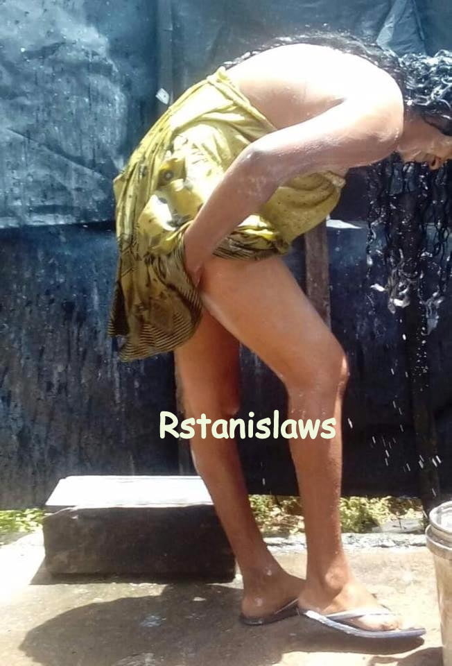 Sri lankan girls bathing outdoor
 #80867300