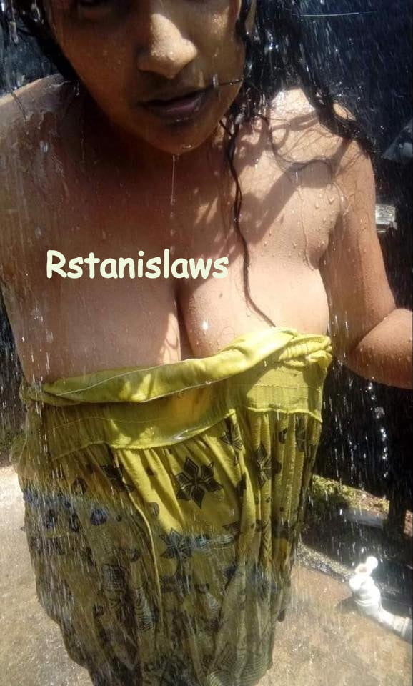Sri lankan girls bathing outdoor
 #80867318