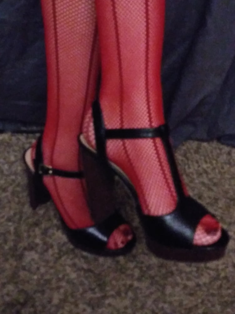 red fishnets and black heels #106710597
