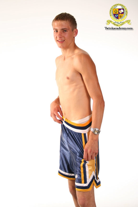 Blond teenage Latvian hunk poses in his basketball uniform #106930055