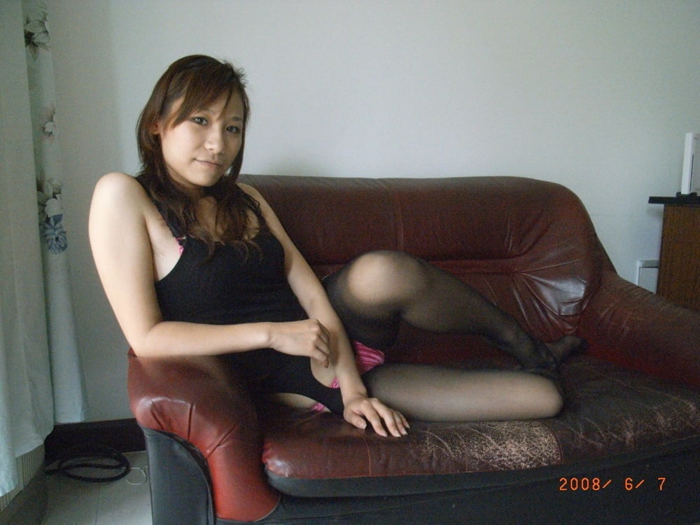 Sexy Asian on Red Couch #105088903