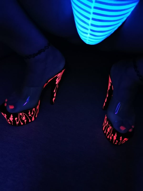 Sexy CD Feet On High Heels Posing In Neon Light #106887014