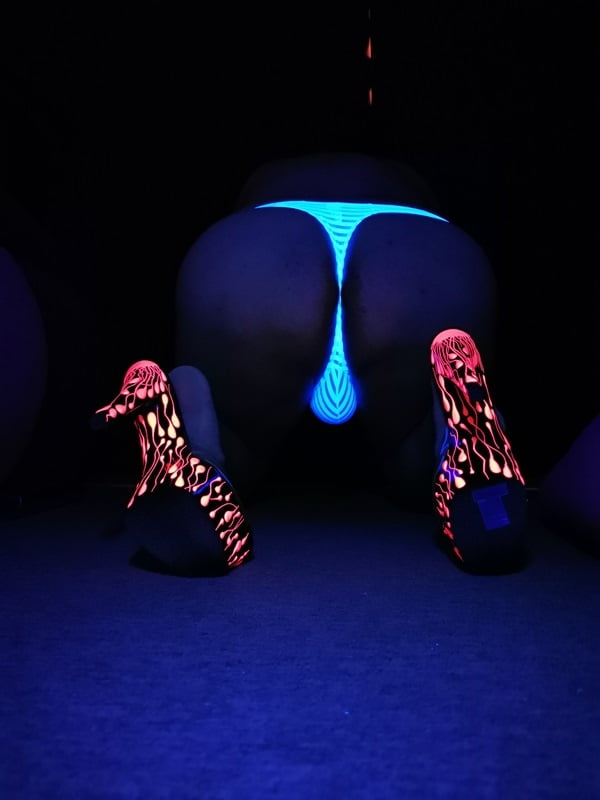 Sexy CD Feet On High Heels Posing In Neon Light #106887016