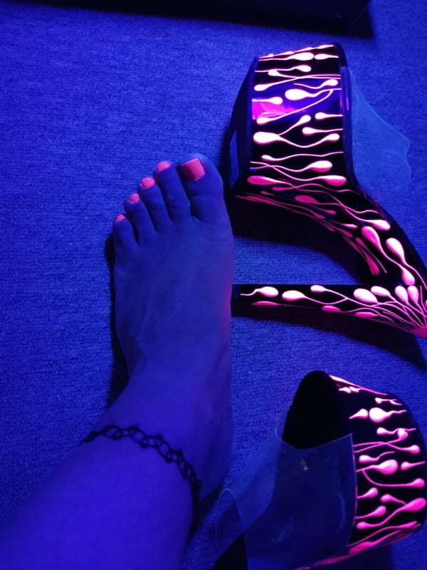 Sexy CD Feet On High Heels Posing In Neon Light #106887022