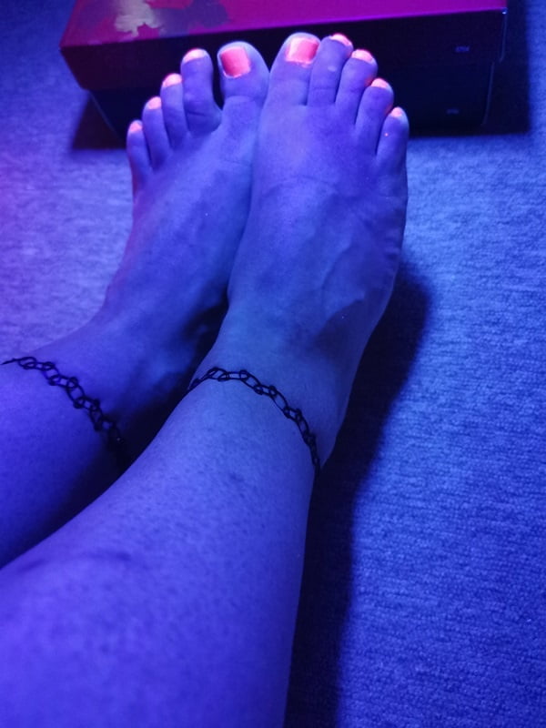 Sexy CD Feet On High Heels Posing In Neon Light #106887027