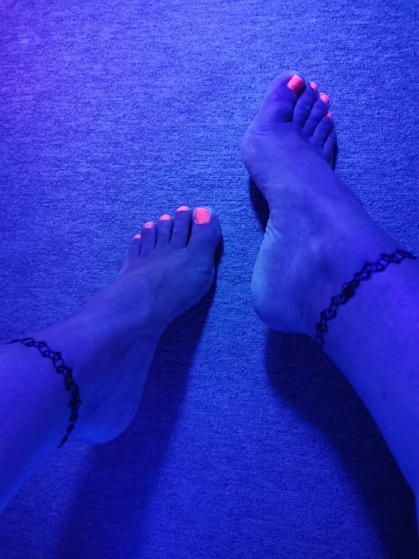 Sexy CD Feet On High Heels Posing In Neon Light #106887030