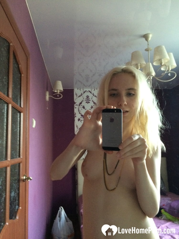 Skinny blonde cutie taking a couple of selfies #107053175