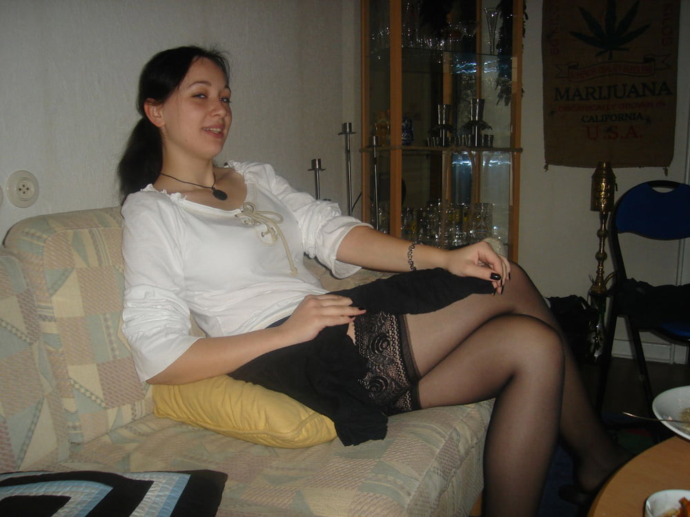 ladies lifting skirt to show her stockings #93749004