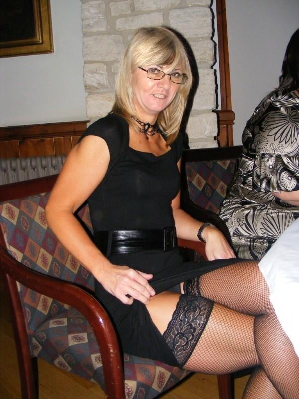 ladies lifting skirt to show her stockings #93749010