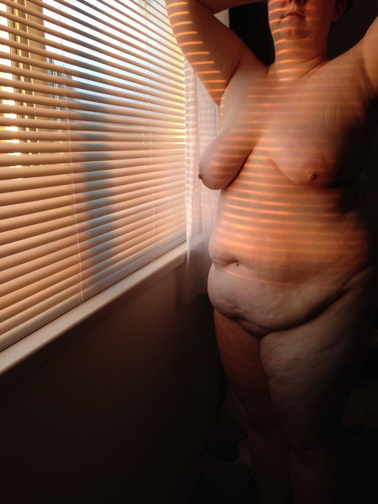 Young BBW by window evening sunset #106853286