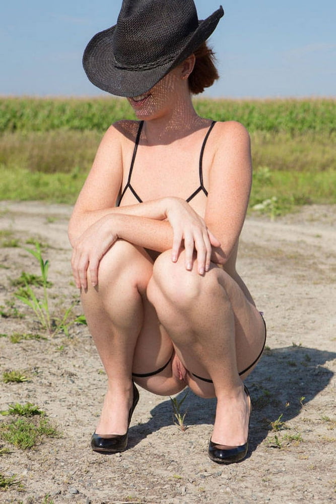 Girl in hut posing in super sexy bikini outdoors #103370666