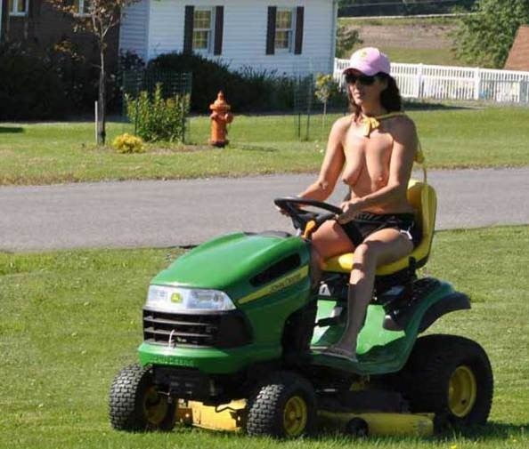 Neighbor lady mowing her lawn today #98430016