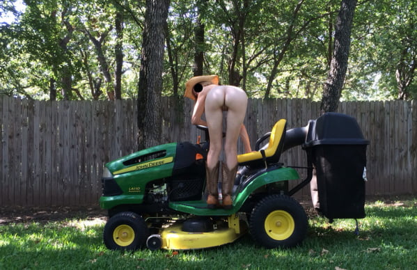 Neighbor lady mowing her lawn today #98430032