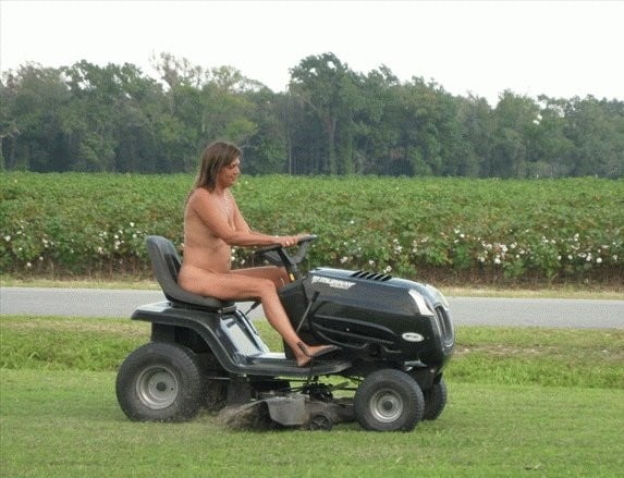 Neighbor lady mowing her lawn today #98430040