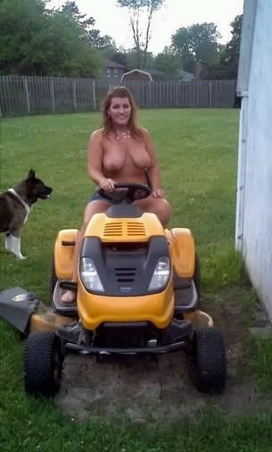 Neighbor lady mowing her lawn today #98430041