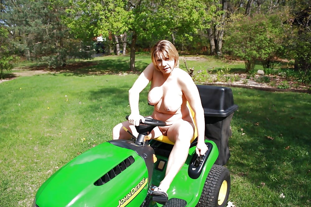 Neighbor lady mowing her lawn today #98430049